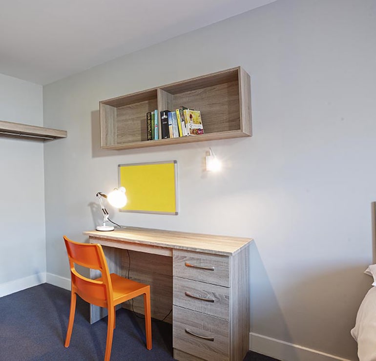Galway Student Accommodation Apartments classic bedroom with desk and shelves at Radical Edward Square